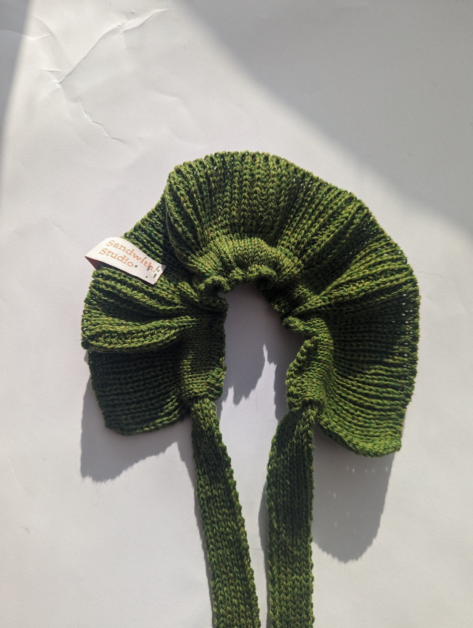 knitted wool scrunchie in moss